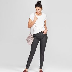 Black coated high waisted skinny jeans